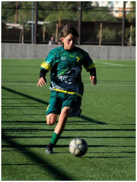 Teen Soccer Player Dribbling