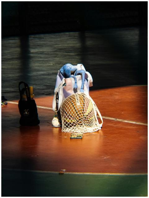 A basketball and sports equipment arranged on an o