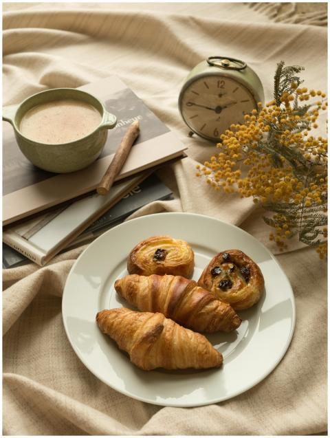 A serene morning scene in Paris with croissants an