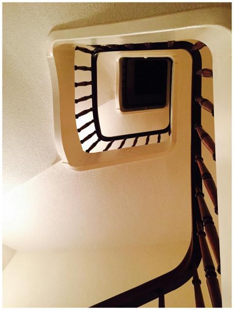 View of a spiral staircase ascending upwards in a