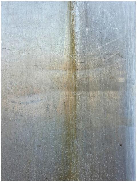 Close-up of a rusted metal texture with a weathere