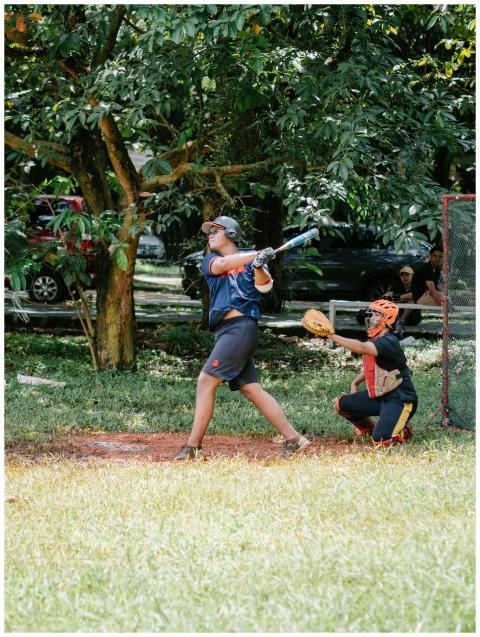 Dynamic outdoor baseball scene showcasing a batter