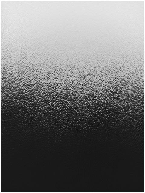 Black and white abstract texture of raindrops on a