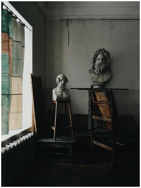 Artistic composition of classical busts in a shado