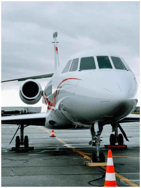 A sleek modern jet aircraft parked on the runway a