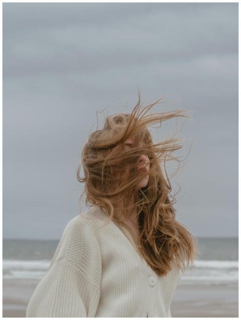 Side view of pensive young female traveler with lo