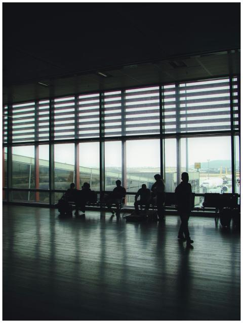 Silhouette of travelers waiting in Ankara airport