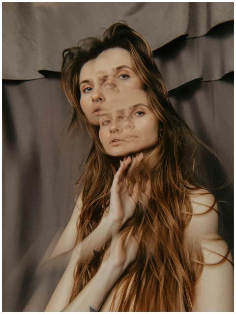 A creative double exposure portrait of a woman wit