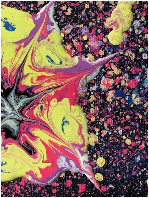 Colorful fluid art painting with bright red, yello
