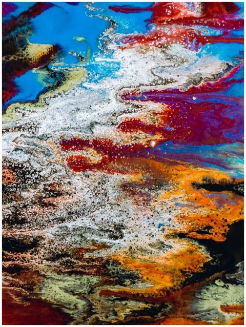 Colorful abstract acrylic pour painting with intri