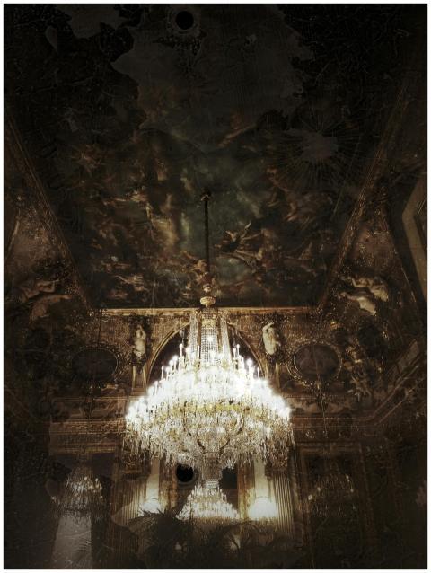 Opulent chandelier illuminating a richly decorated