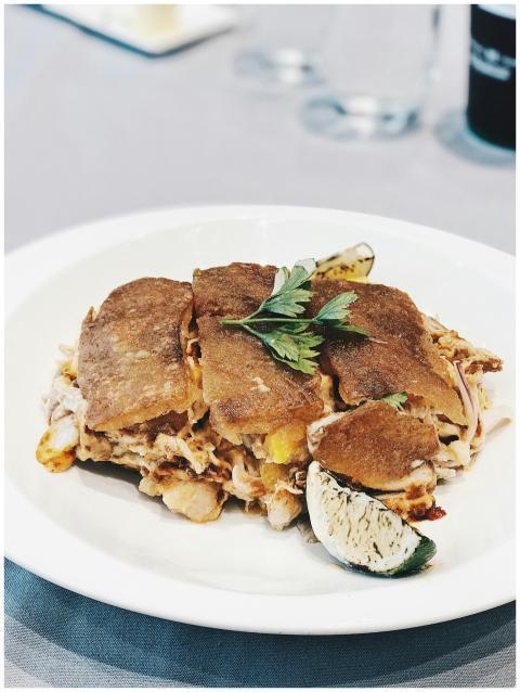 Close-up of a savory meat quesadilla served with a