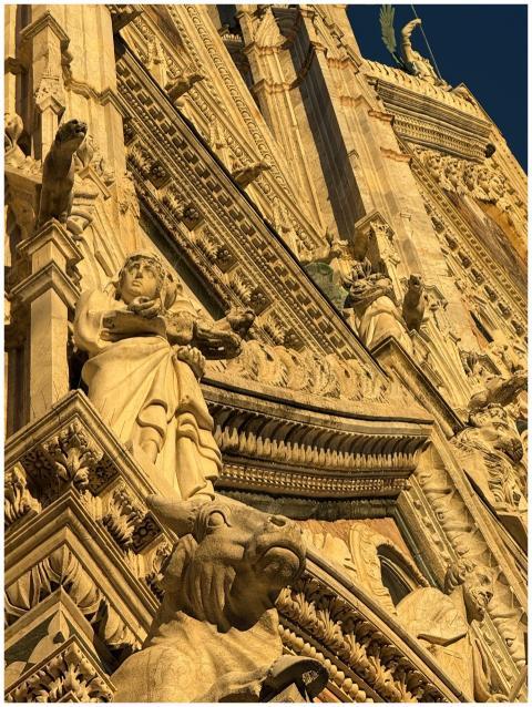 Close-up view of ornate Gothic sculptures on the D