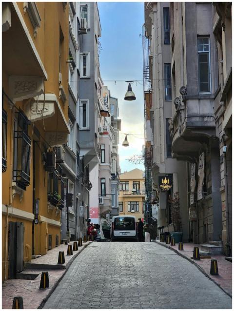 Narrow European street flanked by old buildings un