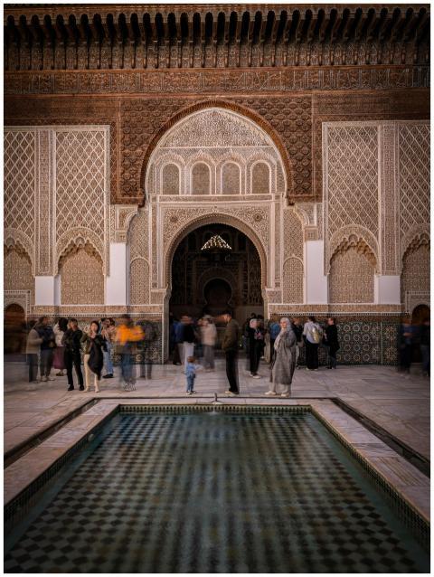 A lively scene at a beautifully ornate courtyard i