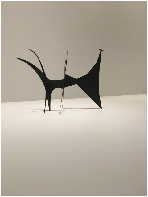 Minimalist black sculpture in a contemporary art g