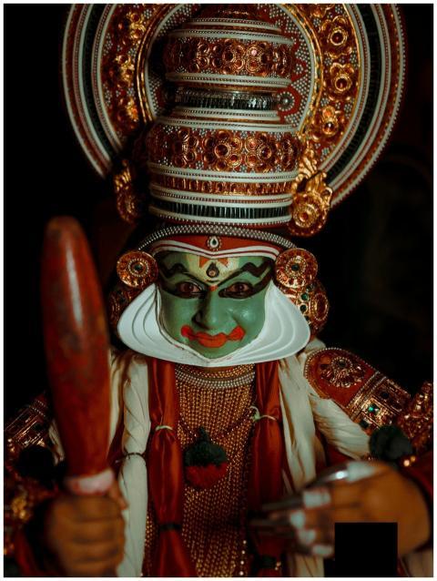 Vivid portrait of a Kathakali performer in elabora