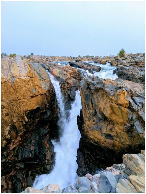 Beautiful waterfall cascading through rocky cliffs