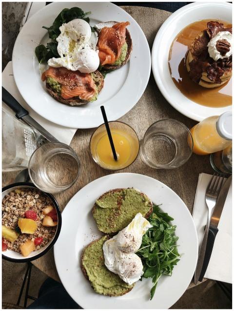 Top view of plates of assorted healthy toasts with