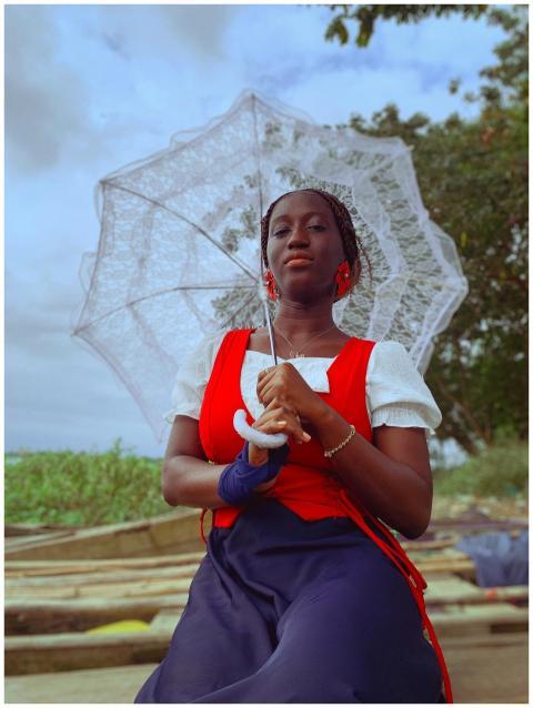 Portrait of a woman with lace parasol in a serene