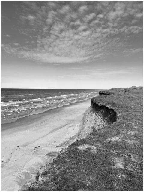 Black and white view of Løkken's dramatic cliffs a