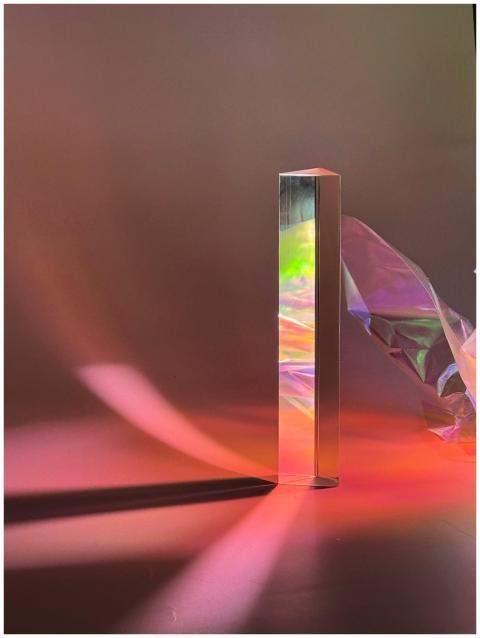 Artistic photo of light reflecting off a prism wit