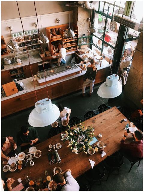 A vibrant aerial view of a busy cafe in Kraków, sh