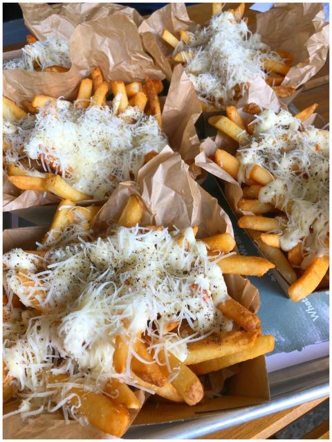 Crispy french fries topped with melted cheese and