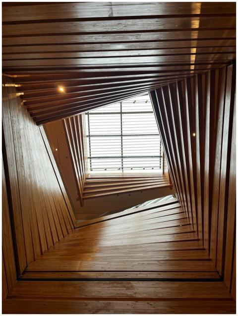 A stunning view of a geometric wooden ceiling lead