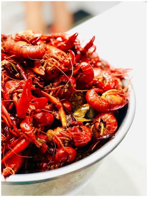 Close-up shot of a vibrant bowl of boiled crawfish