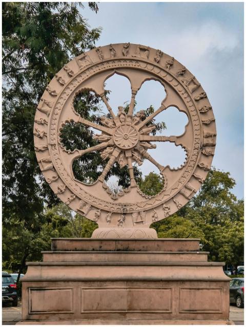 Intricate Stone Wheel Sculpture