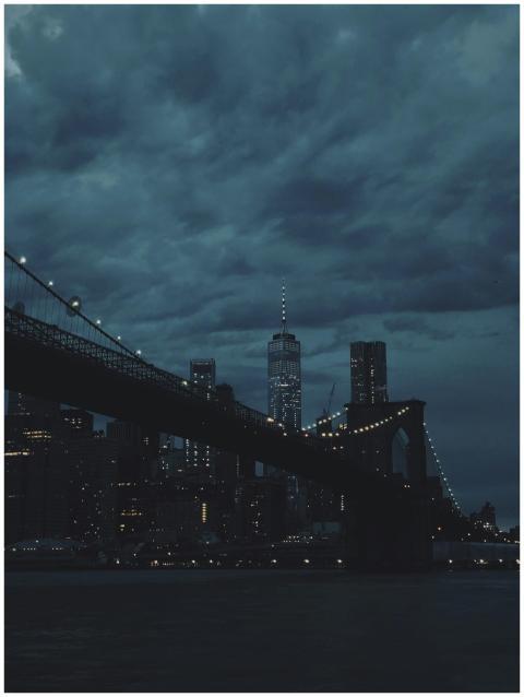 Moody night view of a city skyline with an illumin