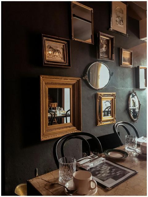 Cozy dining room with vintage mirrors and elegant