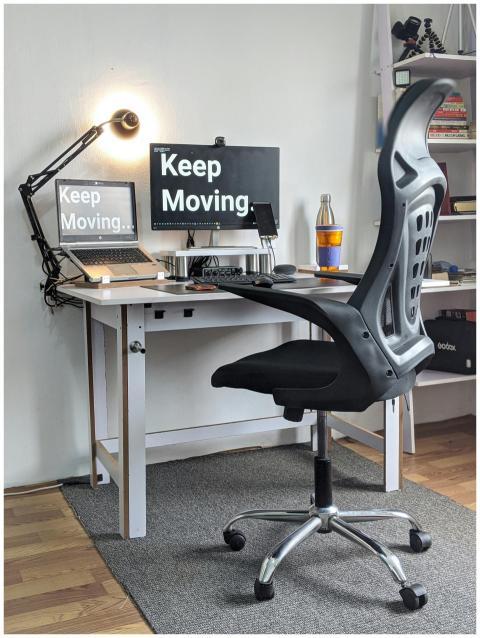 Stylish home office with ergonomic chair, desk, la