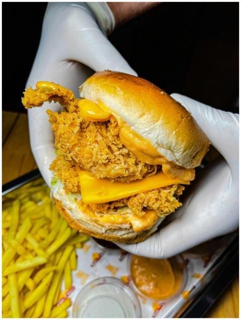 Tantalizing crispy chicken burger with cheese and