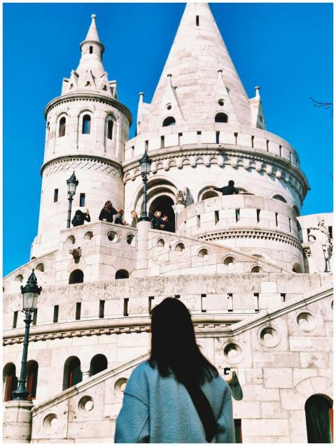 A female tourist explores the iconic Fisherman's B