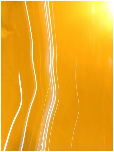 Dynamic abstract image featuring bright yellow lig