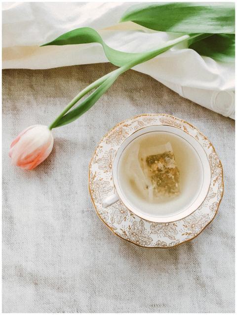 A delicate tea scene with herbal tea in a floral p
