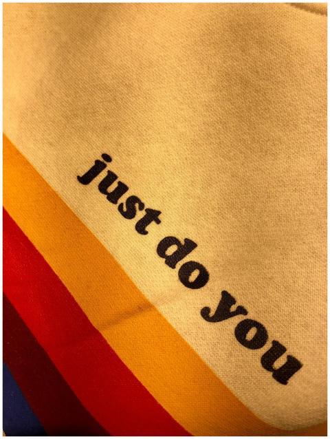 Close-up of vibrant fabric with motivational text