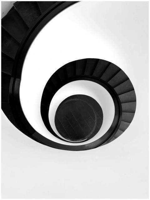 Black and white abstract of a spiral staircase in