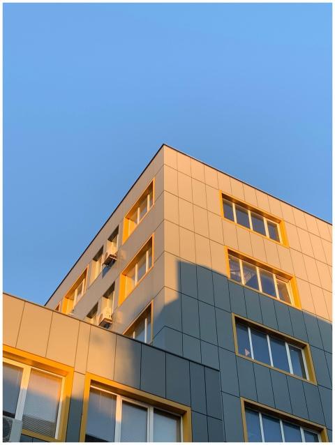 A modern office building with yellow accents under