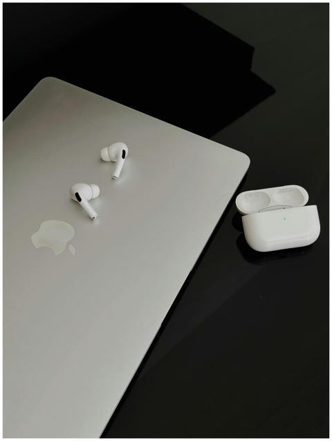 A sleek composition featuring AirPods Pro and MacB