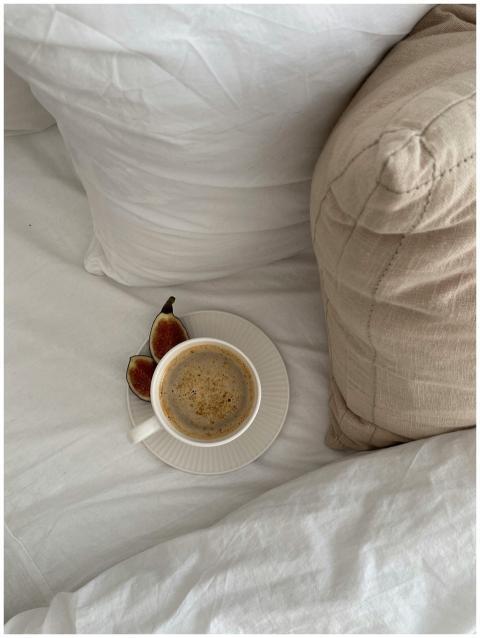 A cozy scene with a cup of coffee and fresh figs o