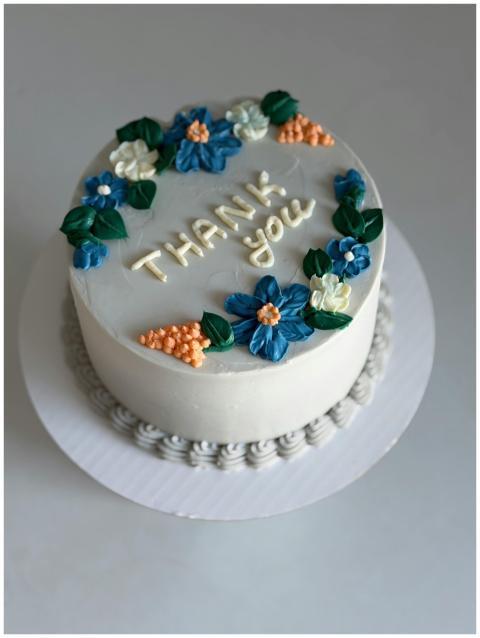 A beautifully decorated cake with floral icing and
