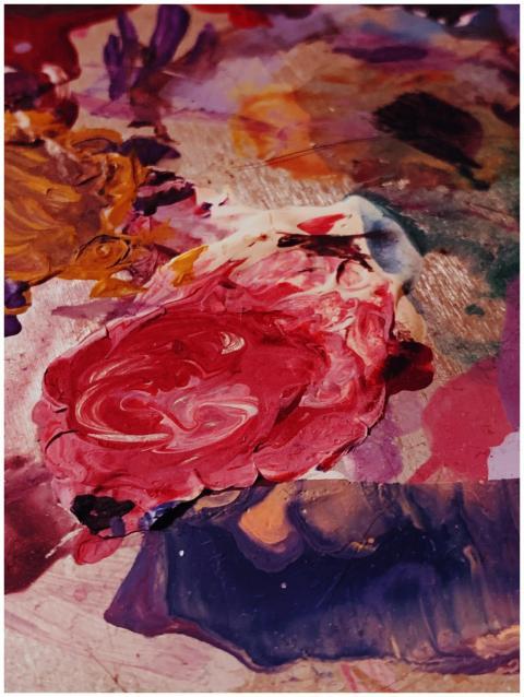 Close-up of a vibrant abstract painting featuring