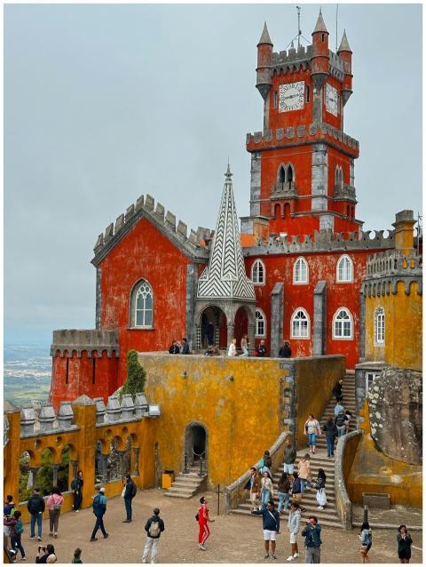 Capture the beauty of Pena Palace, a colorful arch