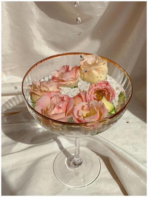 Close-up of colorful flowers in a glass dish with