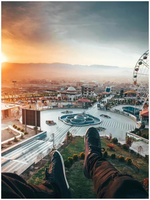 Captivating aerial view of a ferris wheel and urba