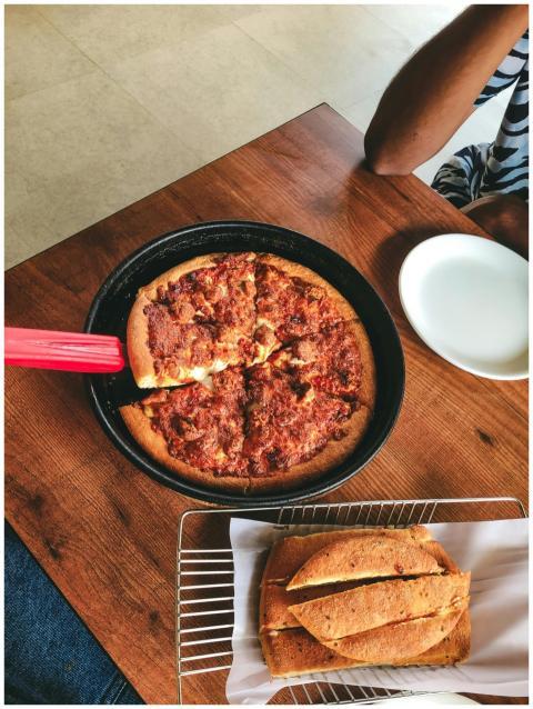 Tasty pepperoni pizza served in a black pan with a