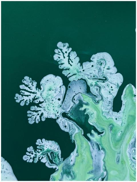 Vivid abstract painting featuring green and white
